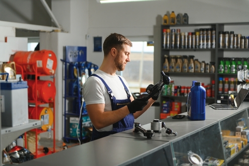 Man in car parts shop.