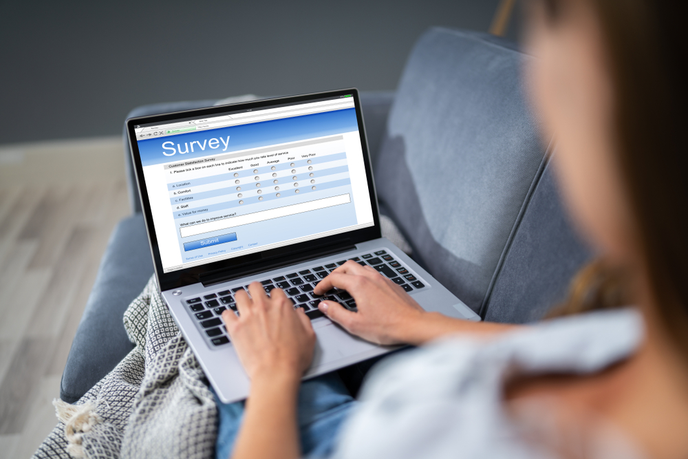 A laptop open with the word survey written on.